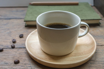 Cup Of Espresso / Cup Of Espresso And Roasted Coffee Beans Scattered On Wooden Background.