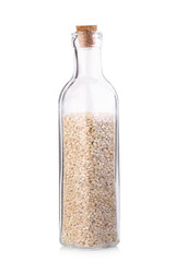 the organic millet rice in transparent glass bottle on white bac