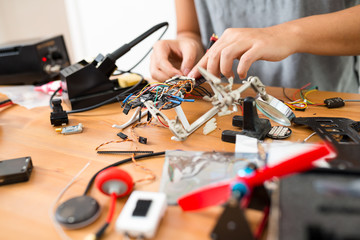 Man installing the component on drone body