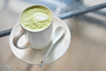 Hot green tea in a cup