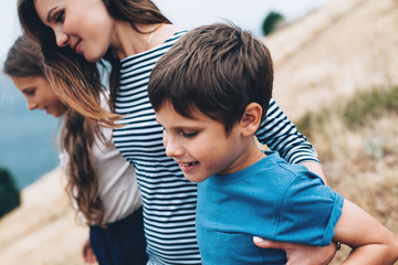 Mom with children walking outdoor