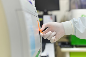 Hand scientist working in laboratory.