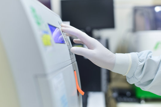 Hand scientist working in laboratory.