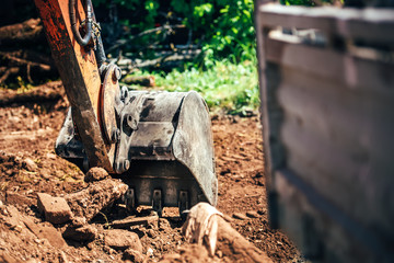 Fototapeta na wymiar industrial excavator scoop, close-up of heavy machinery with metal bucket