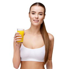 attractivesmiling woman holding glass of orange juice isolated on white