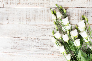 wooden background with bouquet of white flowers