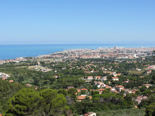 Spectacular aerial panorama of Livorno city made from the nearby hills of Montenero on sunny day, Tuscany Italy