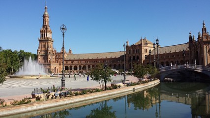 Fototapeta na wymiar Plaza de Espana in Seville, Spain. Tourists are visiting the Plaza de Espana.