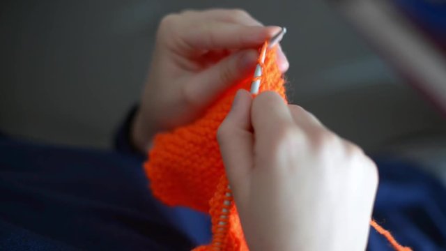 Close up on hands knitting