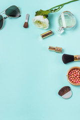 women's clothes on the turquoise background, layout female table