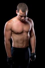 Fototapeta na wymiar portrait of an athlete after a workout on a black background