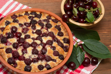 tart cherry in the form of a wooden table covered with a checker
