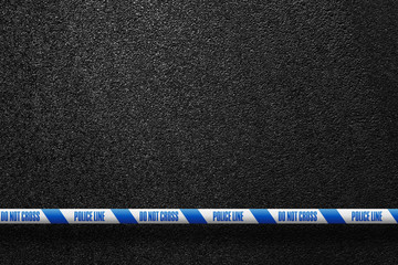 English white-blue police line in the background smooth asphalt road. Do not cross. The texture of the tarmac, top view.