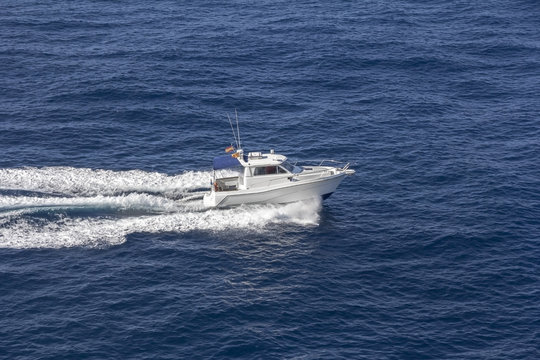 Trail on sea surface behind of speed boats
