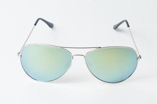 colored summer sunglasses on a white background