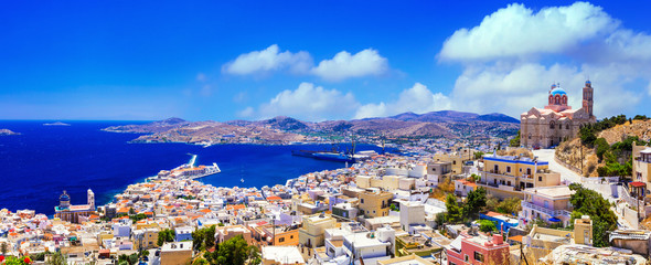 Panoramic View of Syros Island and Ermoupoli Port. Cinematic Landscape of Ano Syros Hill with Orthodox Church and Blue Dome. Cyclades Greece. 12K High Resolution World Print Quality. © Freesurf