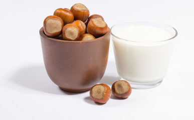 Glass of hazelnut milk isolated on white background.