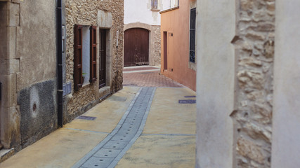 Narrow street on a Mediterranean town in Begur, Catalonia