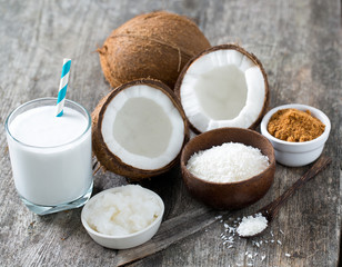 Fototapeta na wymiar coconut sugar, milk and oil on wooden surface