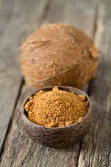 coconut palm sugar on wooden surface