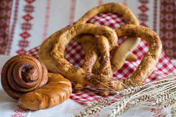 Homemade bread: pretzel bun Snail with poppy seeds and a croissant with jam