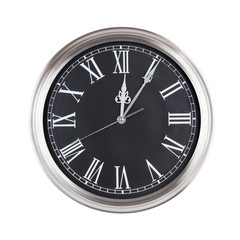 Five minutes past twelve on the dial