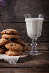 Stack of cookies with glass of milk
