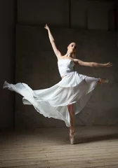 Gordijnen Beautiful ballet dancer in white costume with waving skirt dancing © julenochek