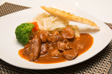 Pork stew with pasta