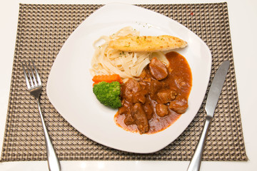 Pork stew with pasta