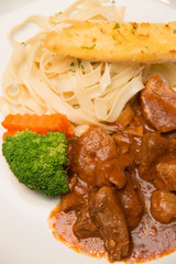 Pork stew with pasta