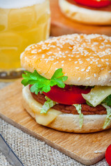 Homemade hamburger with fresh vegetables.