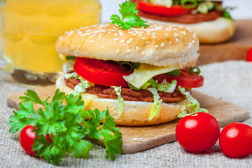 Homemade hamburger with fresh vegetables.