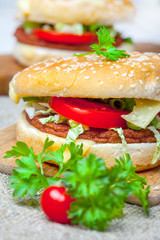 Homemade hamburger with fresh vegetables.