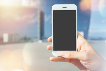 Businessman using cell phone with copy space blank screen tying