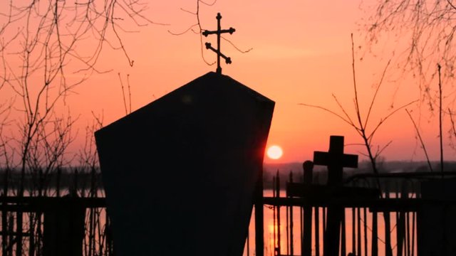 cemetery monument at sunset
