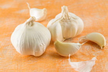 Whole and slices of garlic. Healthy vegetable