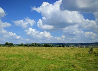 Fototapeta na wymiar Landscape of field and clouds