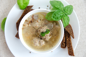 buckwheat soup meatballs white plate basil bread
