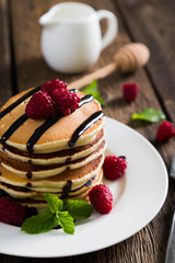 Pancakes with fresh raspberries and chocolate