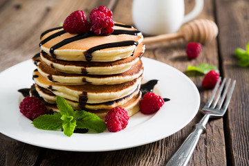 Pancakes with fresh raspberries and chocolate