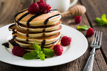 Pancakes with fresh raspberries and chocolate