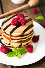 Pancakes with fresh raspberries and chocolate