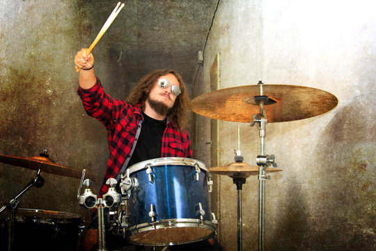 Drums conceptual image. Rock drummer and his drum set.