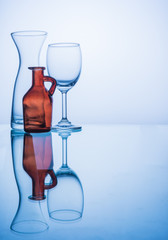 Glasses and bottle in blue color tone.