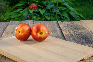 Nectarines juicy. On the desk.
