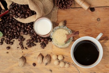 Coffee grinder with coffee beans and cup espresso.