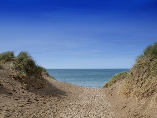Fototapeta na wymiar Footpath to sandy beach UK