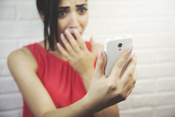 surprised woman hand phone