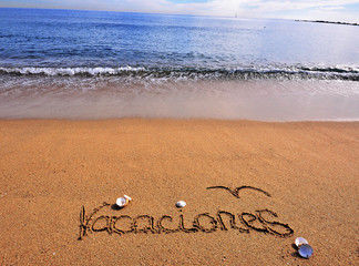 Vacation sign on the beach